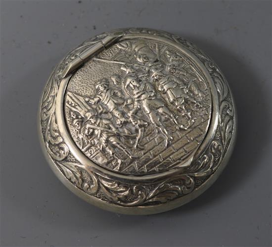 A 19th century Dutch embossed white metal circular pill box, 45mm.